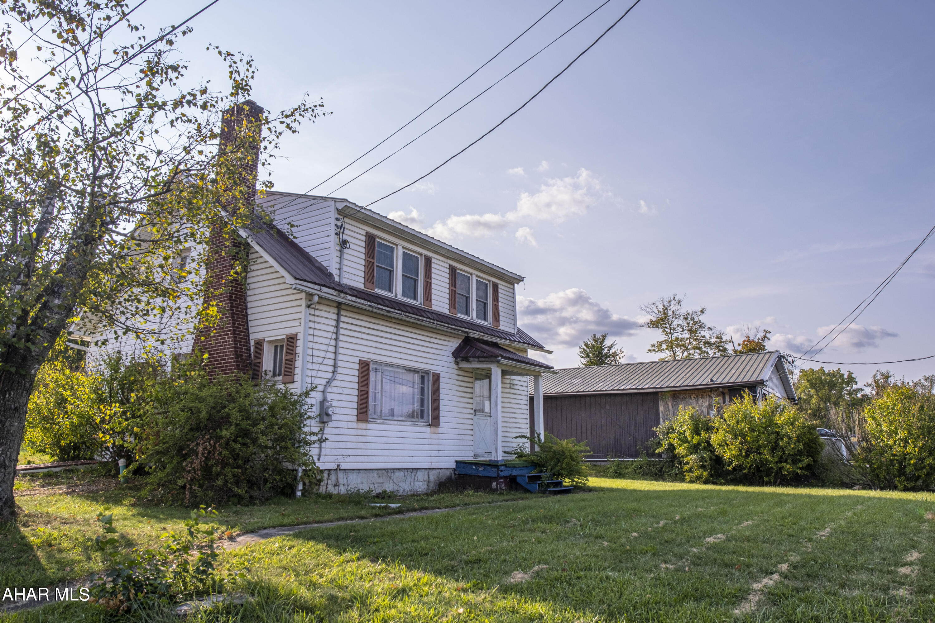 This charming two-story home in Bedford offers 3 bedrooms and 1 full bath. The main bedroom includes two closets, providing ample storage space. The kitchen enjoys plenty of natural light, and the spacious dining room easily accommodates large furniture. The large living room features a cozy brick fireplace, and hardwood floors run throughout the home. Conveniently located just minutes from downtown Bedford on Highway 30, this home sits on a desirable corner lot.