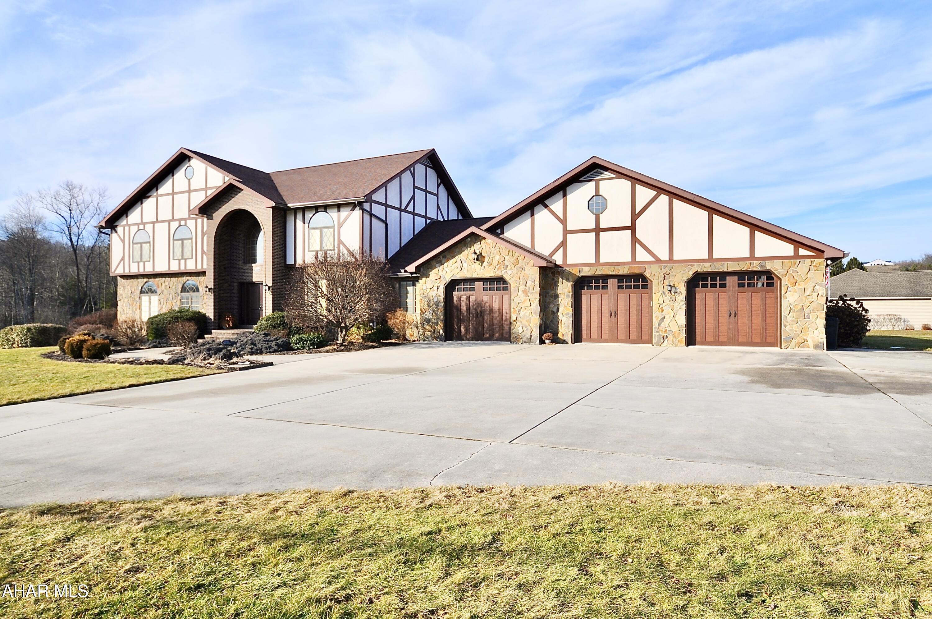This wonderful and spectacular custom built 2 story, stucco, brick and stone home contains 4 bedrooms up, 3 1/2 bathrooms, oversized 3 car attached garage, heated inground pool, and lots of hardscape all on 2.63 acres. Located at the intersection of Route 220, Route 350, and near the on ramp to Interstate I99, you can be in State College, Altoona City, Huntingdon or Philipsburg Boroughs in a short period of time. Fish in Big Fill Run, your own freshwater trout stream which also feeds the freshwater pond. Swim in the heated L shaped in ground pool. This is a one of a kind property and one of a kind find. Don't wait. The photos are great but seeing this in person is even better!