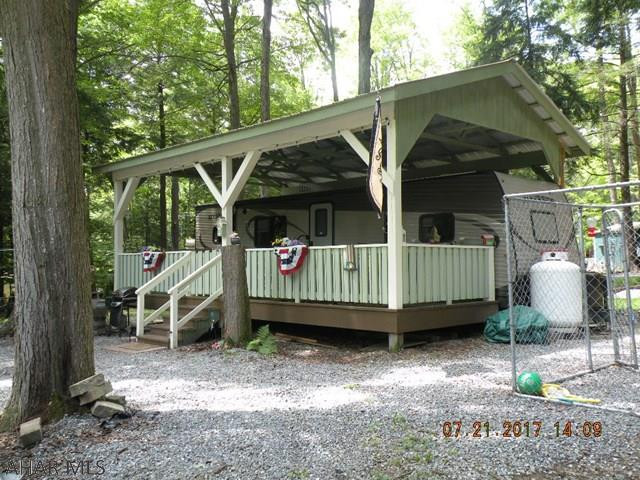 2016 32 ft camper under a pavilion with a deck & shed on 2 lots. Selling to buy cottage. Minutes from State Game lands, State Park, Prince Gallitzin State Park & Rock Run ATV trails.Enjoy the amenities of GYR heated swimming pool, tennis courts & more!