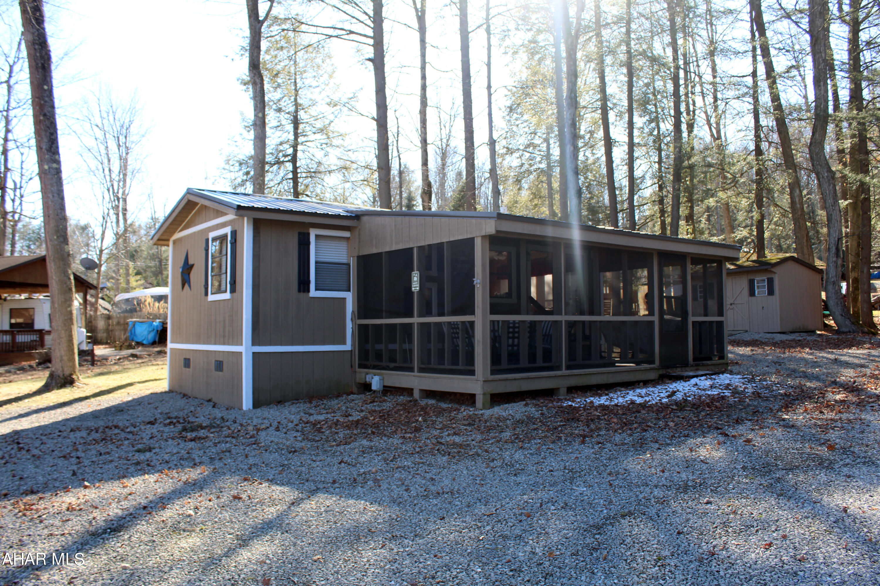 Cabin on large double lot in Fox Ridge area of Glendale Year Round. Sleeps 6. Includes 2 wood sheds, a gas golf cart, furnishings and more! Large screened porch on front. Room to park a boat, camper, or multiple cars. New roof added last fall.