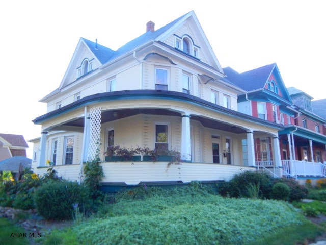 This 4 bedrm, 2 bath home, with a large wraparound porch, is situated on alarge corner lot in Juniata. Living rm with a corner fireplace and pocket doors. Mostly new windows,new furnace and hot water heater. Finished 3rd floor. Det. oversized l car garage with sep. electric. Nice landscaping with lots of flower beds.