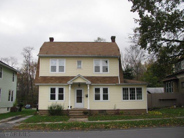 Charming Bellwood Home with in Walking Distance to Schools!  Spacious LR w/HWF and fireplace, Sun room, EIK w/tile floors and updated Cabinetry!  1st flr laundry and 1/2 bath!, 2nd flr w/3 Bedrooms and full bath!  Deck, hot tub, and large fenced yard!!  Garage w/ game room and workshop!  This home has so much to offer!!