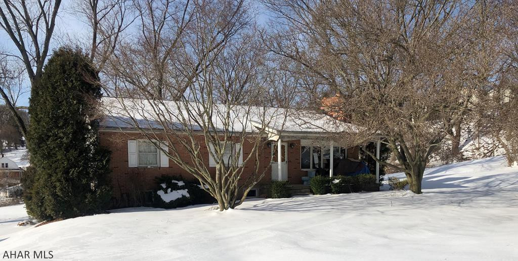 This one story home sits on a large 1.27 acre city lot. 3 bedroom 2 baths that offers eat in kitchen, dining room, living room with fireplace, hardwood floors throughout, , a recently remodeled basement with a family room that has new carpet and drywall and updated 3/4 bath, laundry room, and additional space for storage. I car integral garage, a rear screened in patio located beside an outisde patio that's great for entertaining and a new roof.
