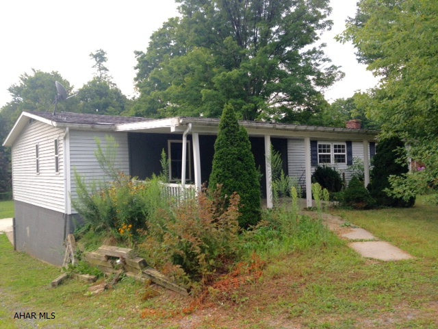 Terrific value. Two bedrooms and two full baths on first floor, one is a master ensuite. Spacious kitchen. New flooring, updated bath. Finished basement. Large deck on back. Large detached garage. This one won't last! Selling AS-IS.