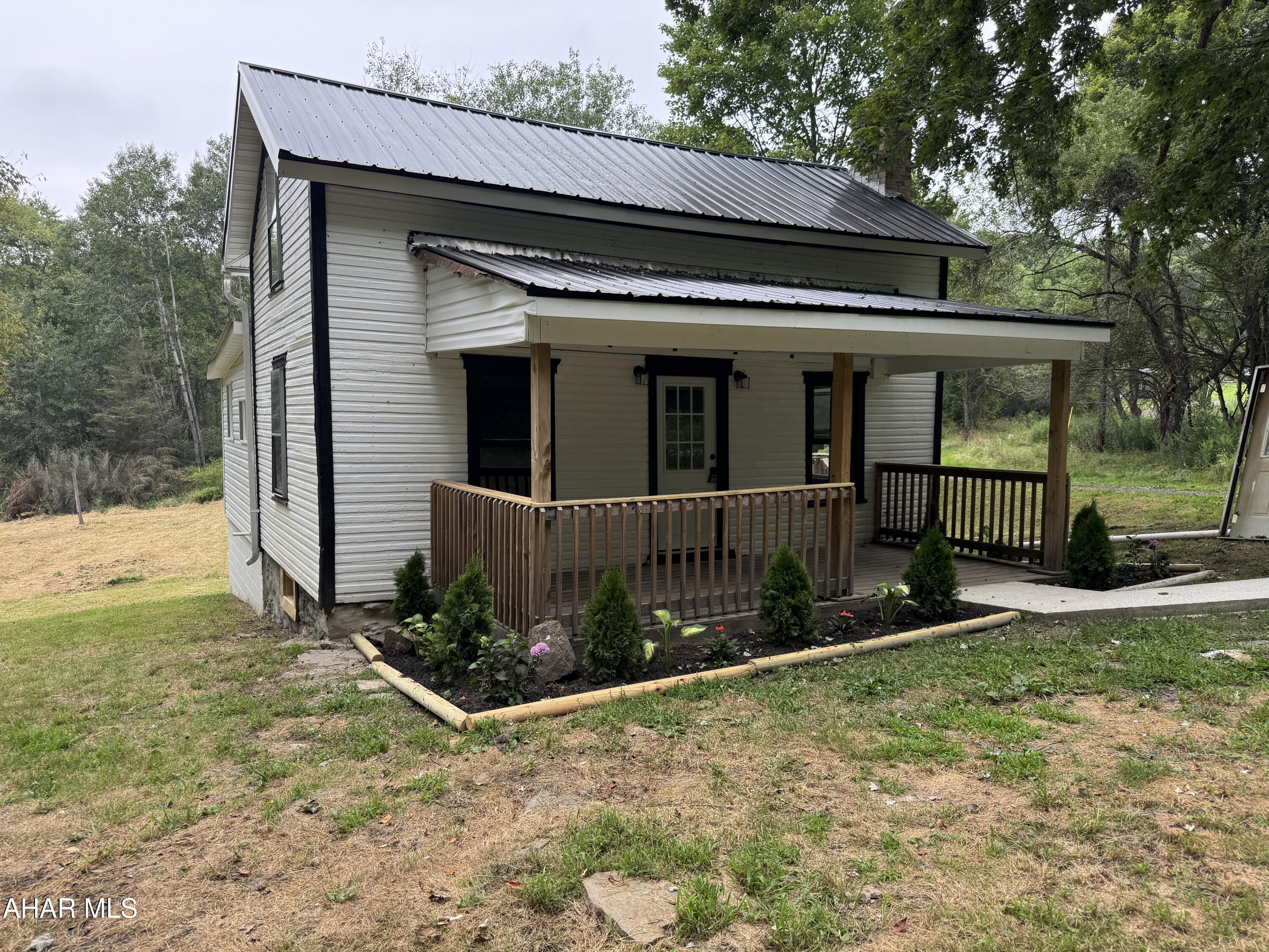 1.5 story remodeled home on a private .8 acre lot. The home features 3 bedrooms, remodeled bathroom, modern kitchen, newer flooring, Full basement with newer furnace and hot water heater. Updated electrical, and plumbing. Side deck and front porch to enjoy the wildlife from. Move in ready home!