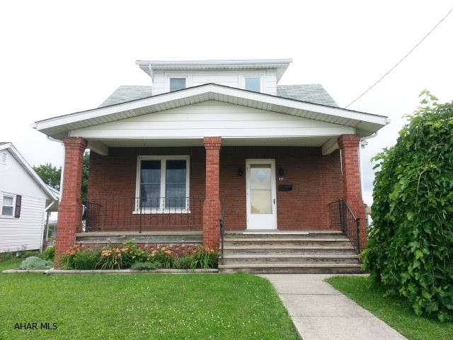 Don't miss out on making this well maintained brick home your new permanent residence. Located in a lovely neighborhood with a fenced yard, large 2 car detached garage and AG pool. Inside has many updates including the kitchen, bath and newer windows. The original hardwood floors and oak trim give this home unparalleled appeal. Call today to set up your tour!