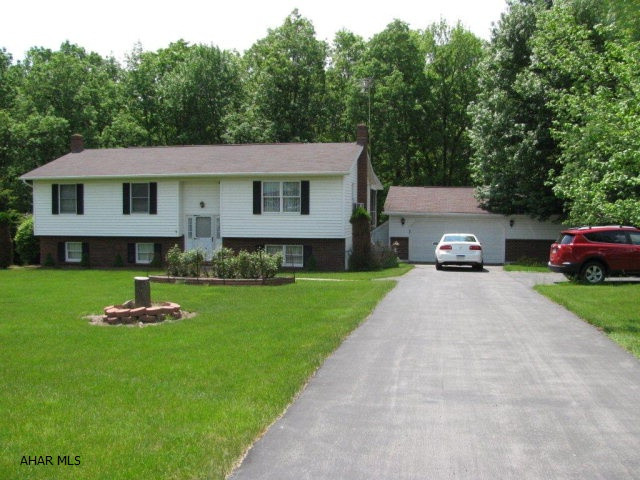 Tyrone Bi-level on 2.7 acres! Spacious LR., DR., EIK., 3 BR., 2 baths, family room w/ fireplace, plus lots of basement storage space and wood burner too! Covered screened deck w/ceiling fan and skylights to watch the wild life in adjacent wooded area! 2 car garage too!