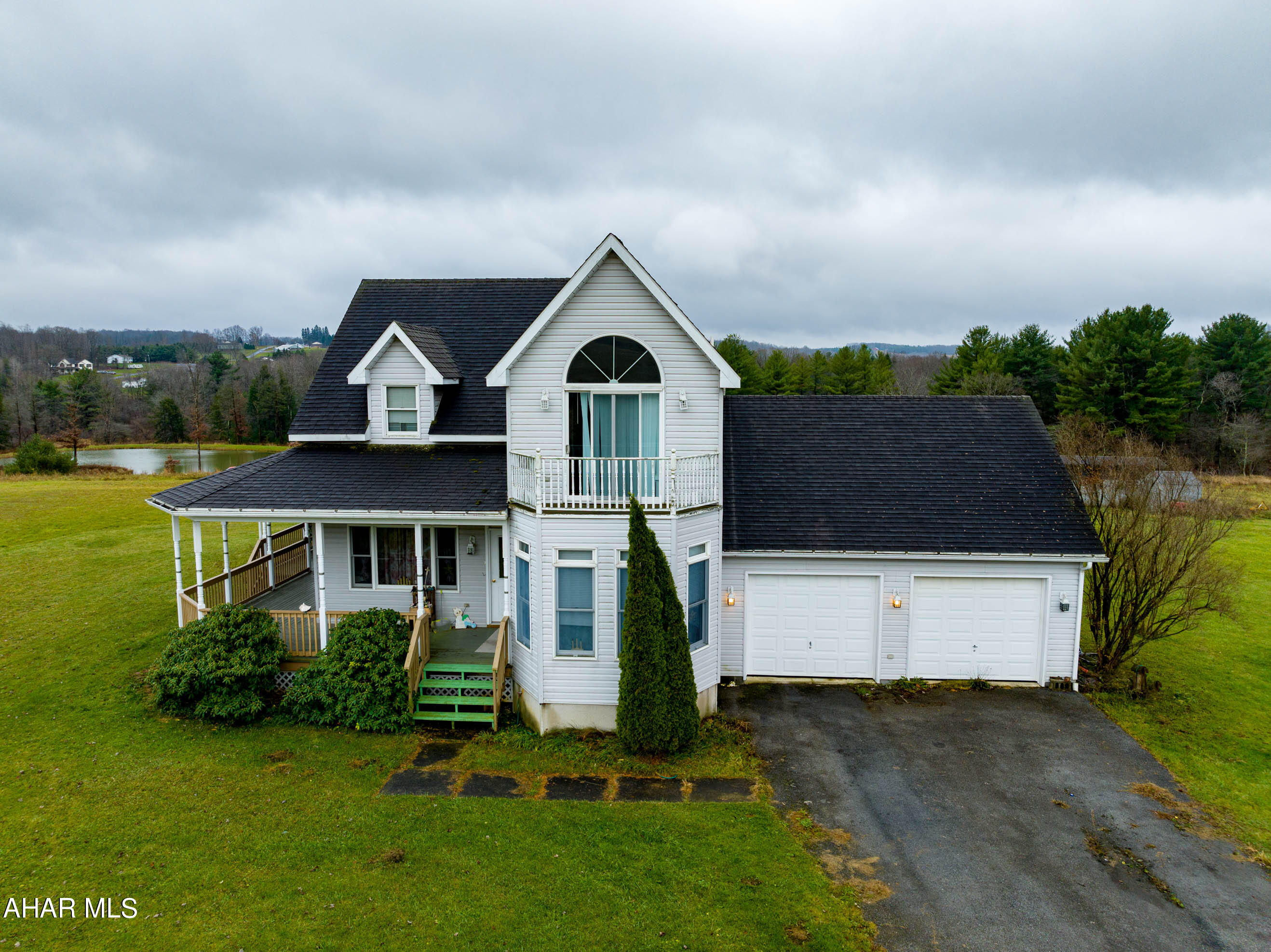 Come see this beautiful gem in Loretto. This 3 bedroom 2.5 bath is outstanding on over 10 acres of flat land. Have a morning or evening beverage on it's wrap around porch. 2 car garage with an above workshop or potential for a 4th bedroom. Possibilities are endless. The spacious kitchen and dinning area are great for entertaining. Take in the views from the sunroom.  Please know there is no sign on the property.