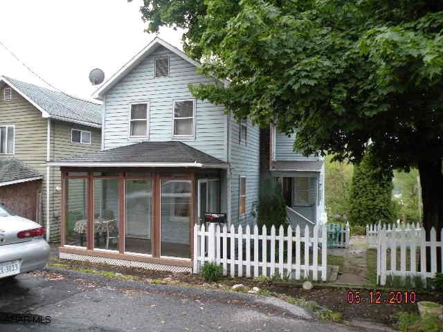 Great Starter homer, nice large Oak kitchen, 3 BRs, 1/2 bath/laundry (stack washer & dryer) Nice sunroom Corner Lot.