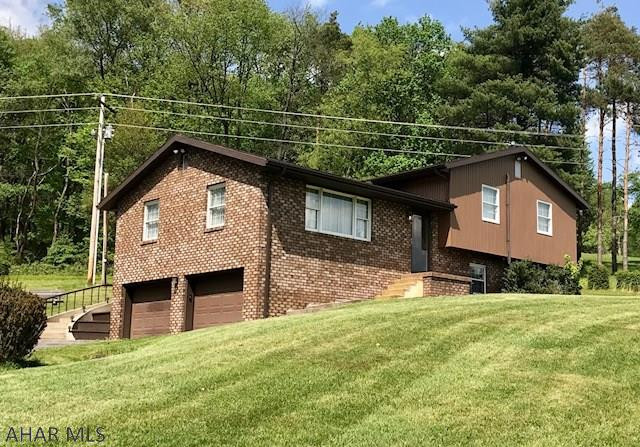 So, you want acreage and privacy and a great price? THIS IS IT!!!  Very private, beautiful and tranquil setting on 33 AC. This  bi level has 3 Bedrooms, 2 1/2 Baths. The kitchen has cherry cabinetry with an abundance of counter space. The Living Room and Dining Room JUST had carpet installed. There is a huge 23 x 18 Family Room with fireplace. There is 4 acres of grass in front of the house and the rest is surrounded by woods. A metal Pole Barn has a great workshop and lots of storage- you can do alot with this newer barn! An added feature is the beautiful Chest Creek which runs through the edge of property. Don't wait too long on this one - it's not going to last! Acreage, privacy, woods and a 3 bdrm house with a newer barn at a great price - Qualified buyers only!