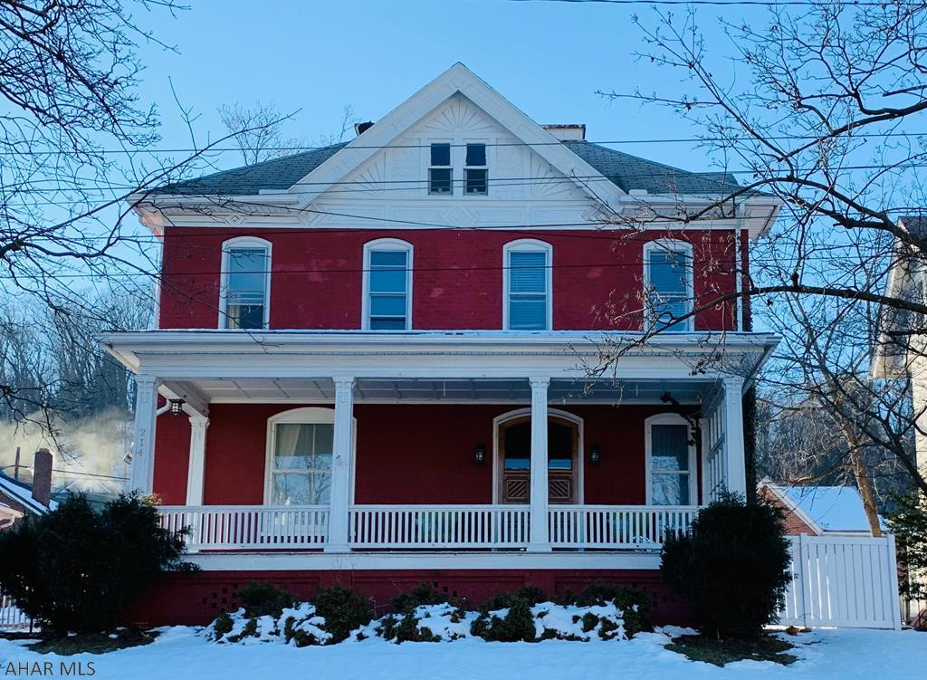 Stunning is the word that best described this beautifully renovated historic gem.  A magical entry off the large covered front porch leads to a grand foyer with architectural details that include circular window, pocket doors, hardwood flooring and impressive moldings.  Cozy up to the newly installed floor to ceiling gas fireplace in the living room flanked by windows and impressive pocket doors.  The newly renovated kitchen overlooks a fenced private back patio and yard with gorgeous mature trees.  Enjoy the bright and sunny eat in kitchen with its new stainless steel appliances while you serve wonderful meals in the inviting formal dining room.  The spacious bedrooms have all been renovated to enhance the overall historic appeal while the bathroom is a show stopper.