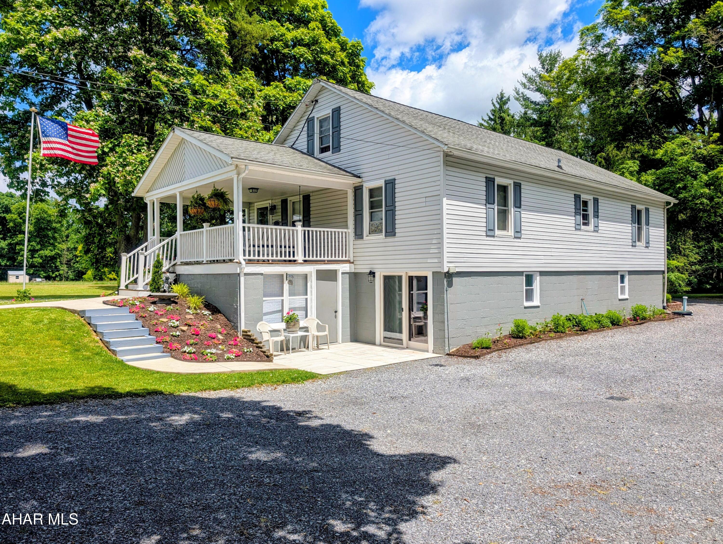 Welcome to 4762 Cortland Road, New Paris--a beautifully maintained home situated on 6.28 scenic acres with breathtaking country views in every direction. Lovingly updated throughout the years, this property offers the perfect blend of charm, comfort, and functionality.

The main level features a spacious living room, formal dining room, and an expanded kitchen complete with an island and dining area, making it ideal for everyday living and entertaining. Two bedrooms and a full bath complete the main floor. Upstairs, you'll find an additional bedroom and a versatile bonus room that could serve as a home office, playroom, guest space, or hobby room.

The finished lower level provides even more living space, including a family room with sliding doors leading to the patio, a recreation room with a cozy pellet stove, a large laundry room, full bath, and utility room.

Outdoor living is just as impressive with a welcoming covered front porch, side deck accessible from the kitchen, a large two-bay garage, and a spacious storage building. Numerous upgrades have been completed throughout the home, including replacement windows, an expanded kitchen, updated flooring, and beautifully refinished hardwood floors.

Enjoy the peace and privacy of country living while being just 11 minutes from the recreational opportunities of Shawnee State Park. This move-in-ready property offers space, views, and quality updates that are hard to find.