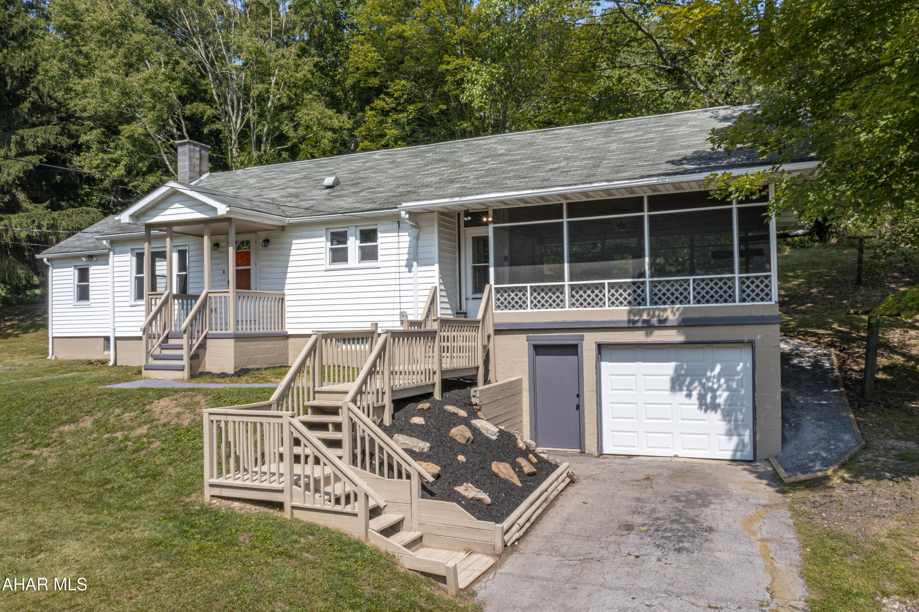 ''Newly updated ranch home nestled on 1.9 acres in the desirable Hollidaysburg Area School District. This charming home features 3 bedrooms, a beautifully remodeled full bath, and a convenient half bath in the basement.  The open concept design seamlessly connects the kitchen and living room, creating a spacious and inviting atmosphere.  The
 kitchen boasts new stainless-steel appliances, including a refrigerator and range/oven, complemented by granite countertops and stylish laminate flooring.  Hardwood floors flow throughout the rest of the home, adding warmth and character.  Relax and unwind on the expansive screened porch, perfect for enjoying peaceful evenings.  With a large basement offering plenty of storage or finishing potential, a one-car integral garage, a 2-car carport, and two driveways, this home has it all! Don't miss out on this opportunity to experience comfortable country living with modern amenities.''