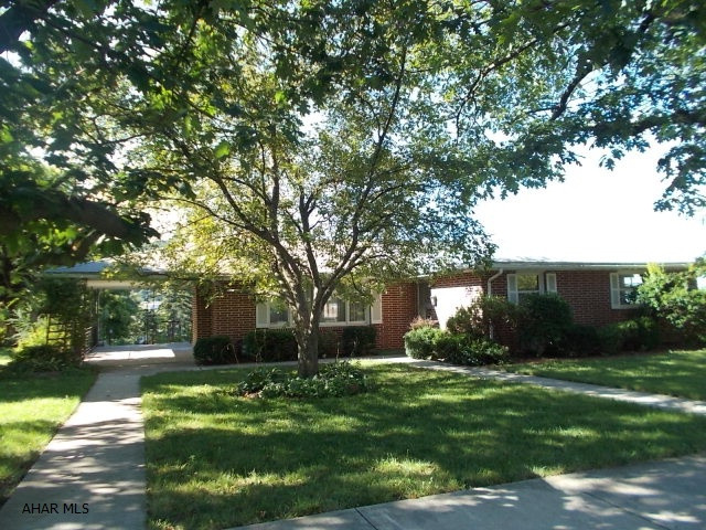 Brick home in the Borough! 4 bedrooms, 2.5 baths. Huge lot, 2 car integral garage heated, 12x41. Relaxing side porch, hardwood floors, large basement with brick fireplace. Needs work.