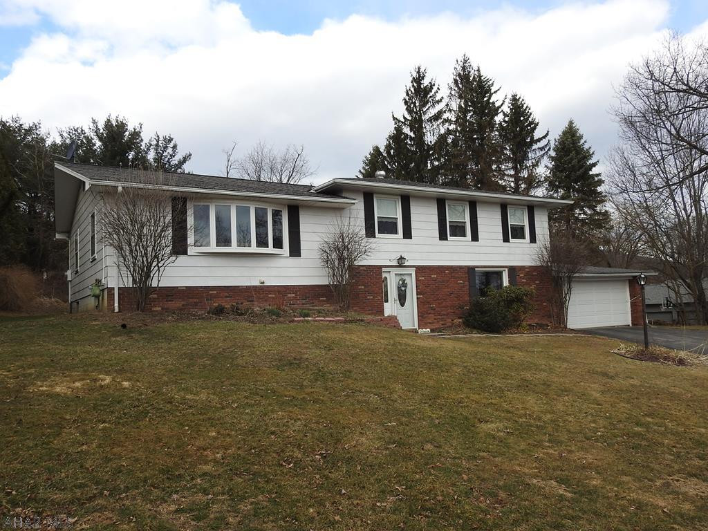 This spacious Hollidaysburg home has many new updates and room for everyone!  Multi-level home features 4 bedrooms, 3 baths, large rec room with new flooring, fireplace, updated 3/4 bath and bar area.  Sliders lead to the patio and back yard with an above ground heated pool.  Upper level features large, bright living room, kitchen with new pantry and dining room with HW floor.  All bedrooms have beautiful hardwood floors and the master bedroom has 2 closets and 3/4 bath.  New 100 amp service. All situated on a private 1/2 acre corner lot in Sylvan Hills.