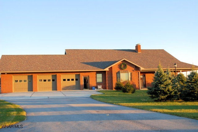 Stunning property with magnificent views. Brick one and a half story home with 3 car garage. Open floor plan encompassing kitchen, dining room, living room,and sun room makes this the perfect home for entertaining and family gatherings. Beautiful finished basement includes game area, family room, exercise area, sauna, and full bath.  20 X 40 inground pool.  Outbuilding with garage, storage, and loft.  All this and a brick pizza oven too!!!
