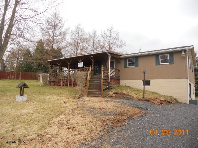 Enjoy country living from the wrap around deck! Great remodeled eat-in kitchen- check out the photos!  3 bedrooms, 1.5 baths, family room in the basement.