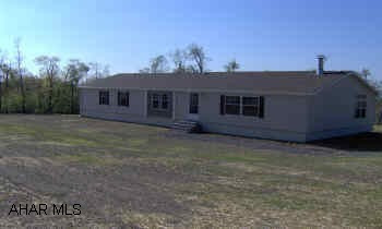Beautiful new doublewide on 12.40 acres. Great country location! Home is top of the line. Many added features-home entertainment system, fireplace, security system, too much to list! Call for details.