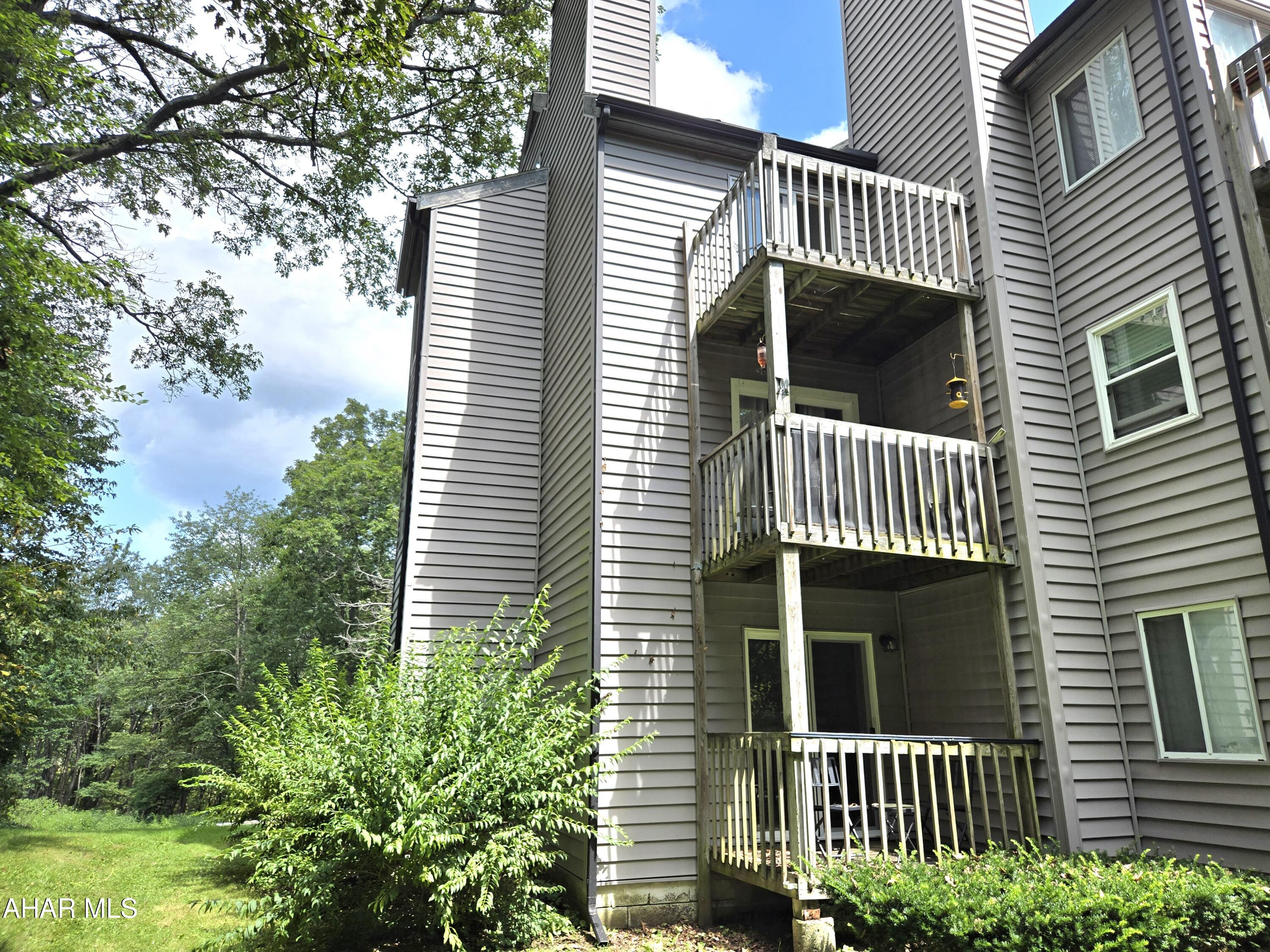 C103 Blue Knob.  Great location woods on 2 sides. Third-floor end-unit condo with spiral stairs to loft. Nice wooded view from balcony and from window at alcove bed and from loft bedroom. Sleeps 6, has skylight and is fully furnished. $290/mo HOA dues include use of outdoor and indoor pools, hottub, tennis court, outside maintenance and trash removal. J-670