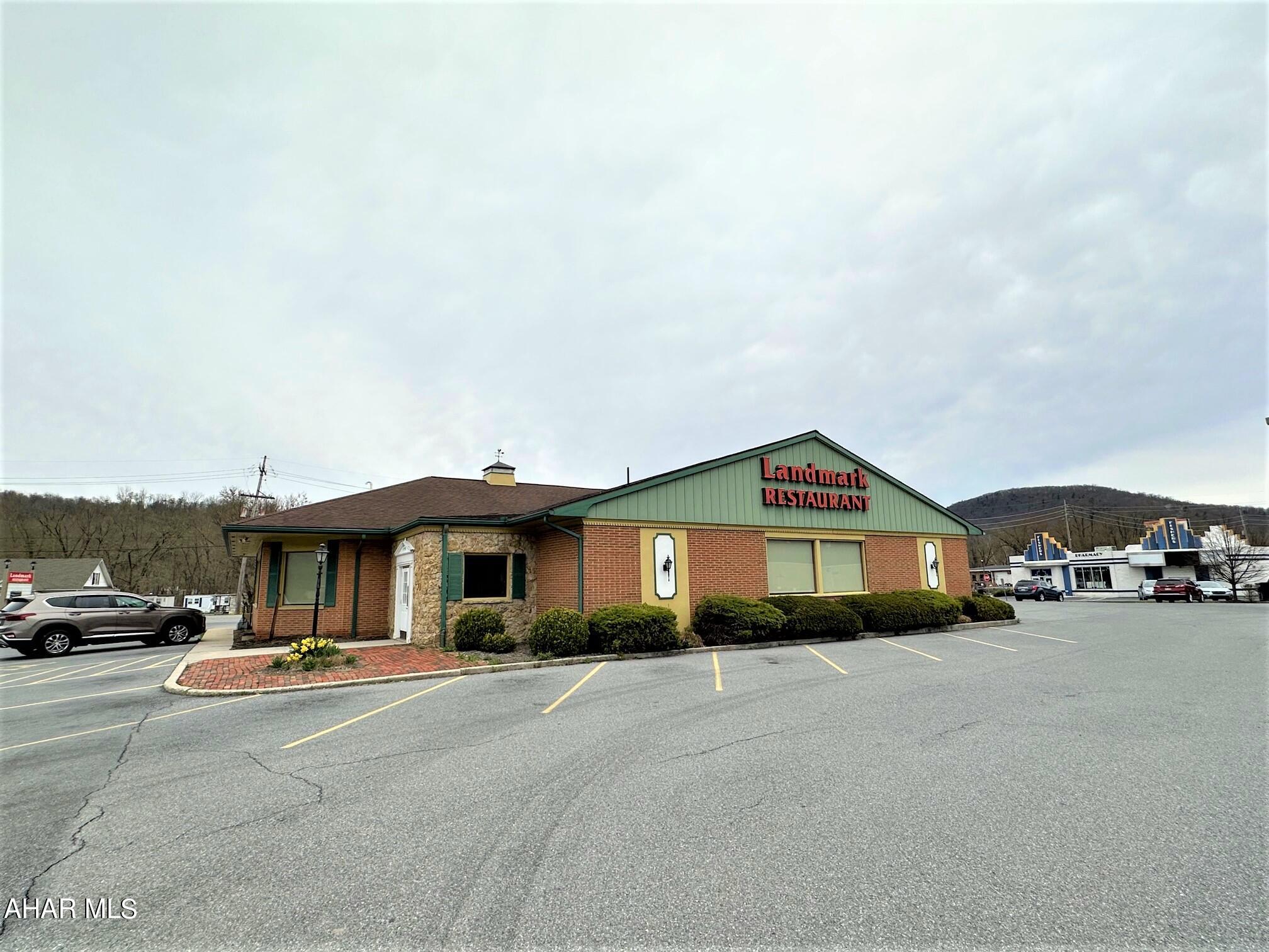 One-story brick building resting on a full basement. Super location just outside the Bedford Borough and in between Pitt and Penn Streets. Large 1.662 acre lot with excellent visibility and exposure. No zoning in Bedford Township. All public utilities on site.