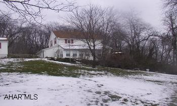 Classic Cape Cod on private, fenced, beautifully landscaped acre, with terrific views.  First floor family room with stone fireplace, sunroom, 3-car heated garage, gazebo, decks, first floor laundry room, newer roof & furnace.  Home has a ton of charm. Classic Cape Cod on private, fenced, beautifully landscaped acre, with terrific views. First floor family room with stone fireplace, sunroom, 3 car heated garage, gazebo, decks, first floor laundry room, newer roof & furnace.  Home has a ton of charm.  Also includes parcel 1.12-16.41, an additional 150 x 120 lot.