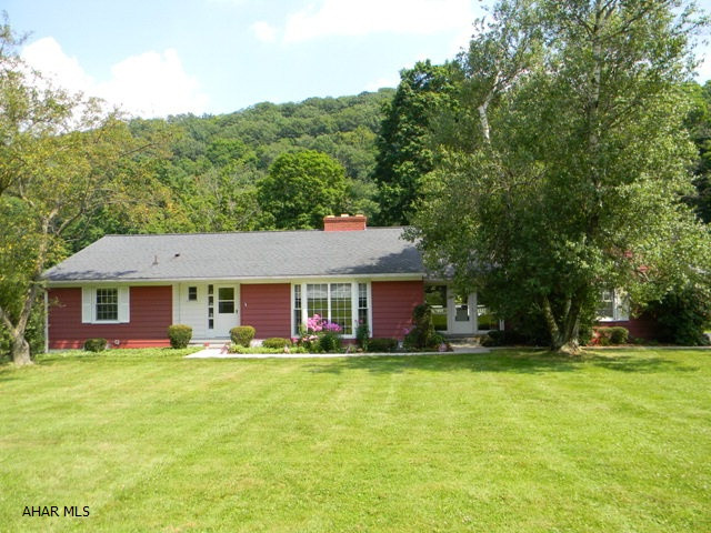 Very well maintained ranch home. 3 Bed, 1 Bath, Kit, D.R. w/picture window, L.R. w/wood FP & Foyer. Full basement w/ additional Bath, Family Room & Kit. Oil H.W. Heat, central air, updated shingle roof & thermo pane windows. Front porch, enclosed porch, maintenance free deck & 2-car attached garage. Convenient location, stream, large yard & macadam drive. This is a Very Nice Property!