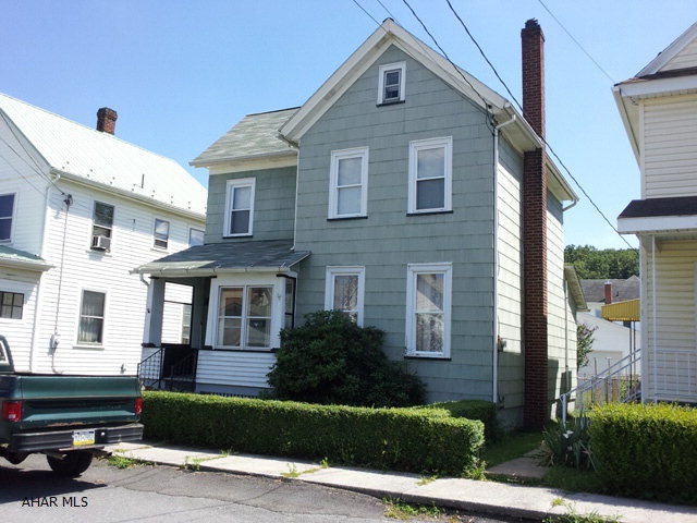 2 1/2 story, 3 bedroom home. Gas HA heating system Enclosed rear porch.