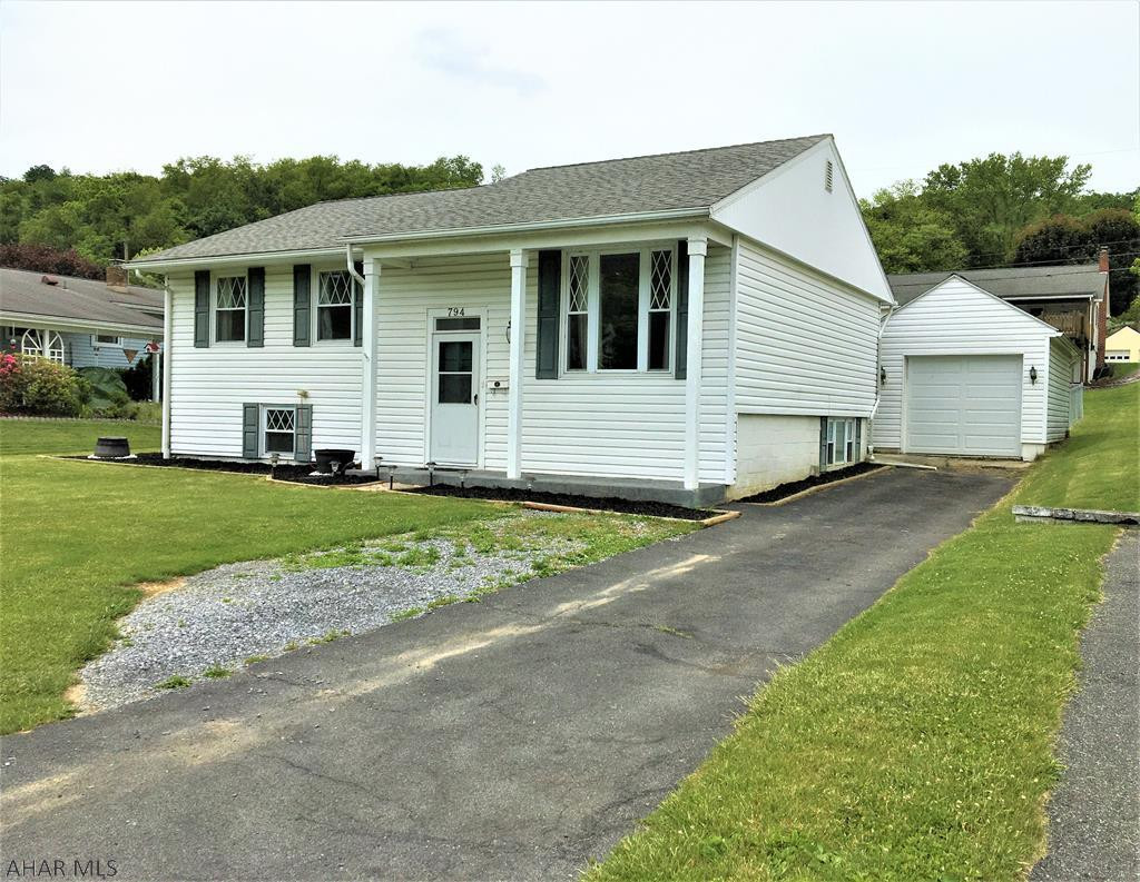 This In-Town Raised Ranch home is much larger than it looks. Open kitchen /dining concept with kitchen appliances included. Three bedrooms with full bath on main level, 3/4 bath with possible 4th bedroom on lower level. Heat pump with F/A heat and central air. Small propane fireplace in lower level family room. One car detached garage with opener. Covered rear deck with a fenced back yard. Within walking distance of all amenities . Be sure to take a look !