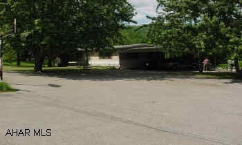 DOUBLE MODULAR ON FOUNDATION ON 19.7 ACRES OF GROUND WITH CARPORT, DETACHED GARAGE AND LARGE 40' X 80' POLE BARN TUCKED AWAY ON A DEAD END ROAD. "REDUCED." FANTASTIC OPPORTUNITY TO HAVE A HOME WITH OVER 19 ACRES OF GROUND, LARGE 40' X 80' POLE BARN, DETACHED 2 CAR GARAGE, INGROUND POOL, ALL ON A DEAD END ROAD IN MAPLE HOLLOW. 3 BR, 2.5 BATHS, FR, SUNROOM (HEATED) 2 CAR CARPORT ATTACHED. 90% IS WOODED. CALL MIKE MANGIA 932-8888.
