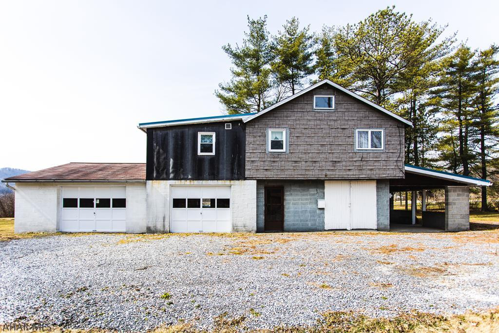 2 bedroom, 1.5 bath house with 2 garage bays and a large yard.
