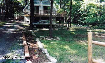 Chalet on the golf course  could be duplex  assoc dues $250 year includes trash,road maintenance,use of pool,tennis courts and sauna