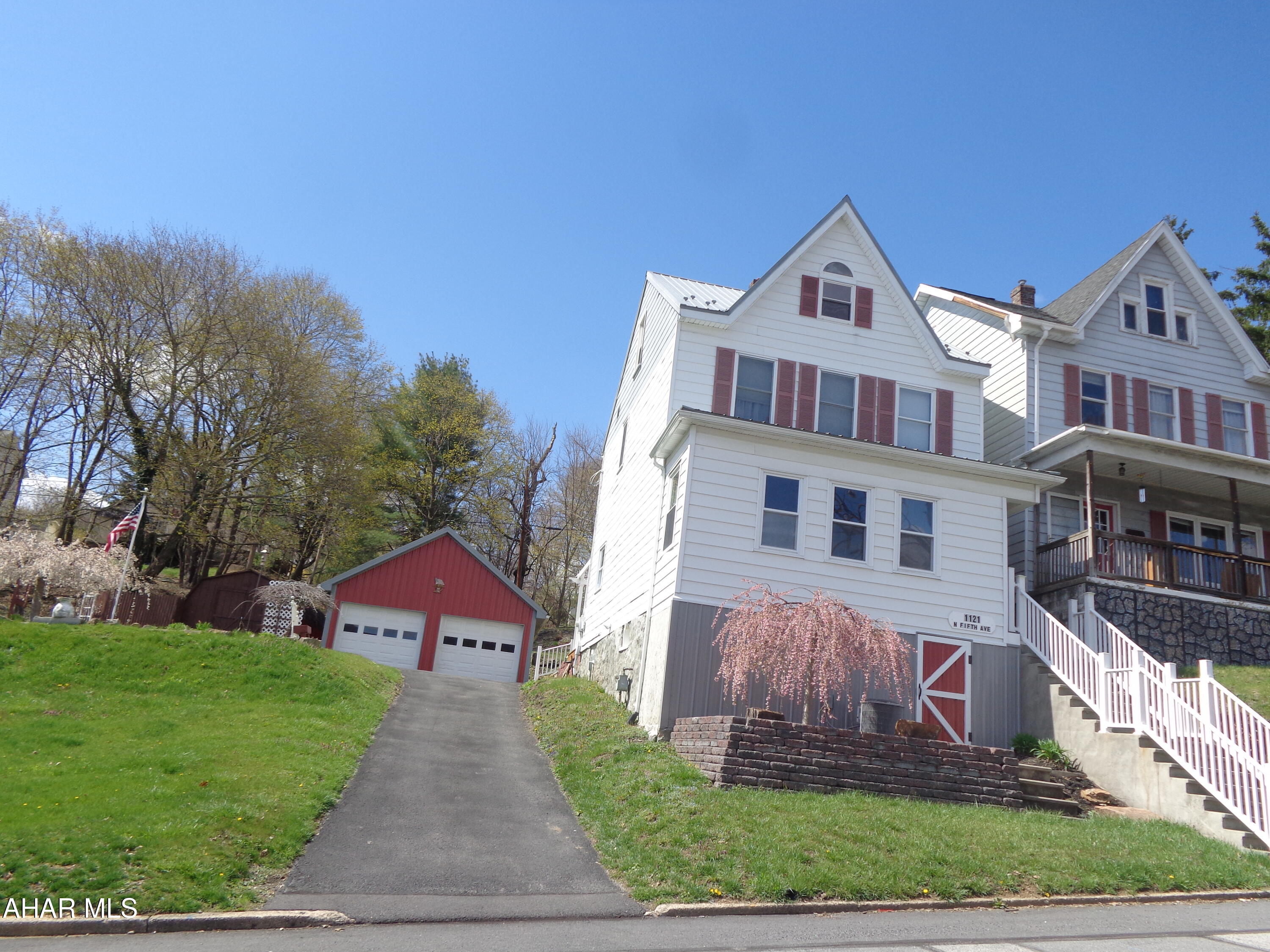This charming & well maintained home is all that you have been looking for!  Situated on 3 city lots .  Beautiful updated kitchen and a sunroom.    The attic has 2 bonus rooms.  There is a  2 car garage with a loft and a shed.  This home is in tip-top shape!