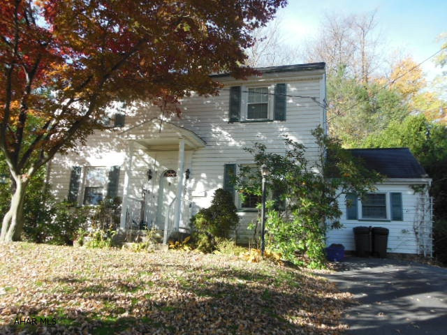 REDUCED!!  Charming 2 story home that sets back on the lot with 3-4 bedrooms, 1.5 baths, appliances and shed. GFA with central air. Screened-in side porch (private) and a garage converted into a game/den/study with a half bath off of it. Formal dining room and a living room with fireplace. New reassessed taxes are noted. Nice comfortable neighborhood to live in. Handy to I99 and mall shopping. Reasonable offer considered!