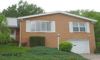 Gorgeous brick home in Calvert Hills. 1st floor master suite, 1st floor laundry, gas fireplace, garage, all on private lot on dead end street.