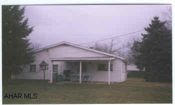 New water/sewer lines to house, w/w carpet, new kitchen floor, triple pane windows, large private lot.  New front & rear porch roofs.  Corner patio, level lot.