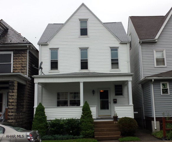 Updated 3 bedroom home with first floor laundry, updated kitchen breakfast bar, gas range, dishwasher, new roof, new front porch with composit decking.  Fenced yard, small patio area, hot water heat.   Thermo pane windows on a pretty block.  Move in ready for only $74,900.