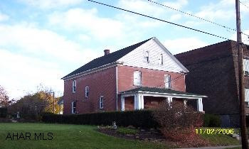 2 story brick, 4 bedrooms, 1.5 baths. 2 porches