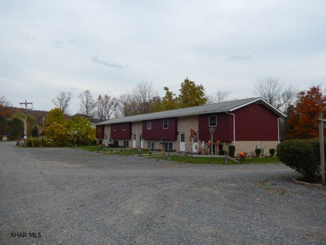 48 unit apartment complex in Antis Township.  The lot size is 30+  acres, only approximately 10 acres is developed leaving 20 ares for future sites.  Tenants pay all utilities except sewer.  Each unit offers 200 amp electric.  This 48 unit housing complex has 2 and 3 bedroom townhouses.  The property has a warehouse that contains 8 bays ansd second floor workshop with storage areas.  Included in sale are a Ford F250 with plow and salter, a John Deere 450 type crawler/loader, Case 580 Mdl backhoe, dozer,  dump truck, riding mower, various lawn equipment and building supplies, 5 refrigerators, 2 electric ranges, and more for a turn key operation.  Qualified buyers only can contact for more information.
