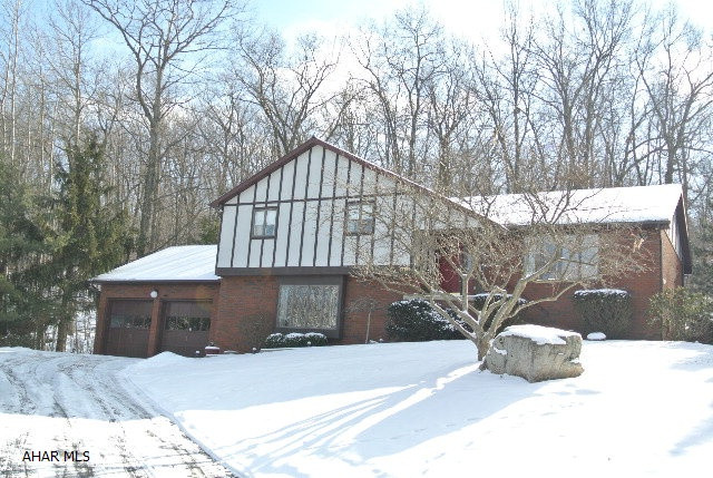 Beautiful well maintained multi-level with wooded setting behind. Watch the deer from your private patio. Updated kitchen-all appliances stay. Very efficient electric heat. A variety of perennials await you this spring. A special house in a quiet, private location.