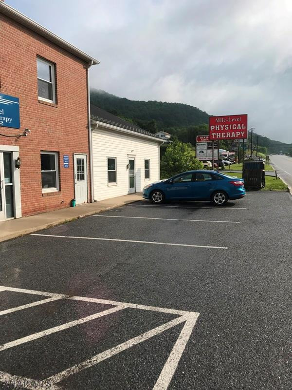2200 square foot office space. Public reception area with bathroom,  large front office; 4 individual offices, conference room, kitchen and bathroom. Several storage closets as well.  Two entrances at street level. Landlord will help pay for signs; one lit on pole. Tenant pays for graphics and insert.