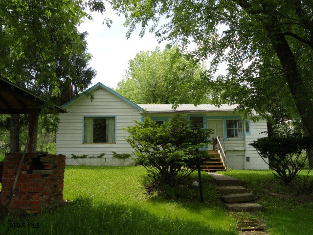 Property includes a one story 2BR, 1BA house and a detached garage with storage area on the ground level and a 1BR apt on the second level. The house and apartment are currently tenant occupied.  Rent for house is $450 and apt is $400. The garage/storage space are used by the owner but could also be used as a rental. 24 hour notice to show.