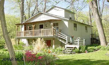 DVB: 315/865, 245/272, 215/180, 313/66 Year round residence or seasonal cottage. Secluded setting with room to grow. Furniture and apppliances included.