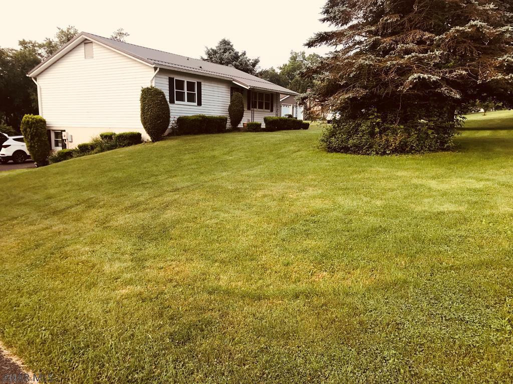 Fabulously located 2 bedroom, 2.5 bath home with tons of storage. Gorgeous lot beautifully maintained. Great walkout basement with 1/2 bath.