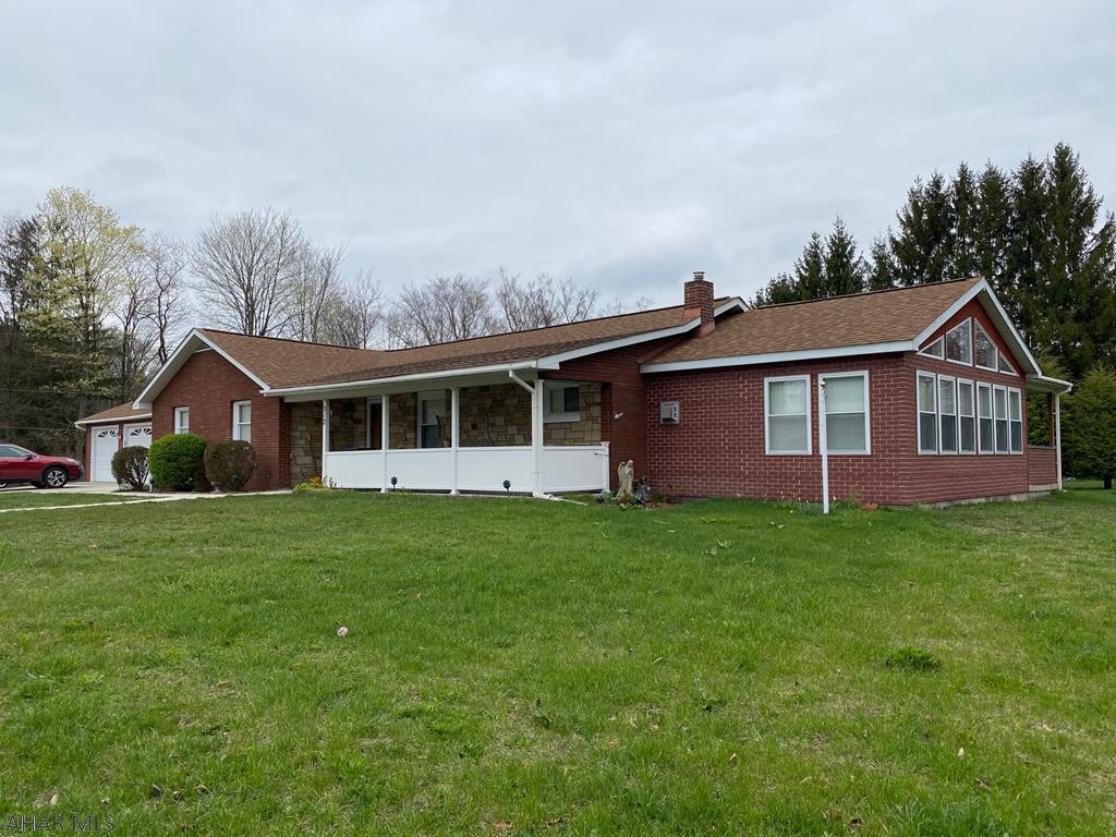 Lovely Quiet Neighborhood! Expansive 3 bed brick ranch on large level .41 ac lot with 2 car det garage. Many updates include newer roof, flooring, kitchen cabinets, appliances, large tile bath with separate shower and tub. Lovely sunroom addition has vaulted ceiling, and cozy gas stove fireplace for year round comfort. Living room is spacious and. Small office can easily be converted back to 1st fl ba/laundry area. Efficient 4 zone gas hot water heat plus central air for the best of both worlds!  Expansive lower level is partially finished and waiting to be what you want it to be! Front porch as well as a rear covered and open patio allow for outdoor dining or relaxation. New sewer line and copper water line to street, 220 amp elec.. Very well maintained! CALL! LOW INTEREST=BIGGER $$ HOME!