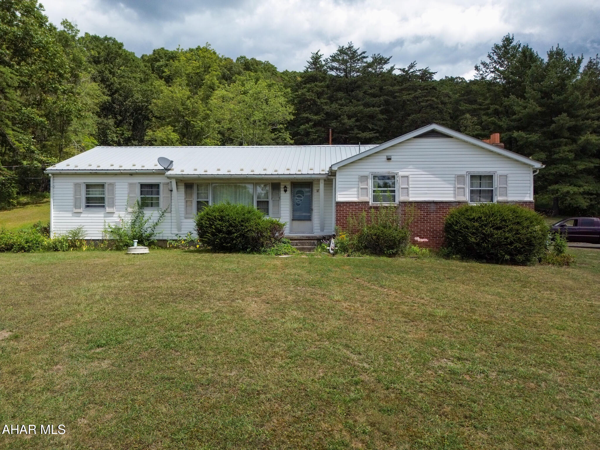 Here is a home with 1.7 acres that has unbelievable potential.Land adjoins State Game Lands. If you are looking for a fixer upper or a home to flip, you have just found it. Has a great floor plan and so many great features to work with. 3 bedrooms and 2 bathrooms, bonus room that could be a 4th bedroom/ craft room or office. Nice size living room , nice size main floor laundry area. Private well, Public sewer. Call to take a look !