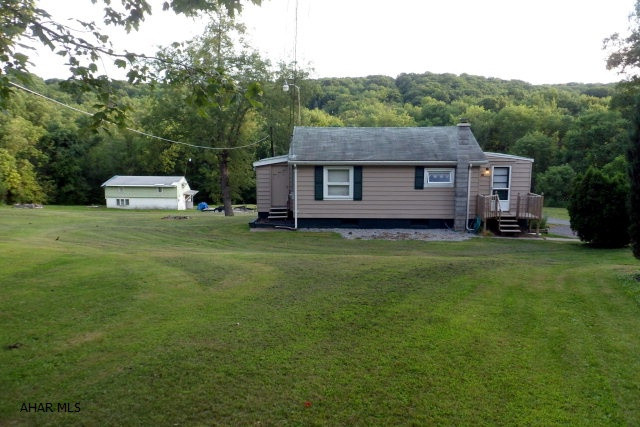 Logan Township - One Story - 113 Western Lane - $74900 - .52 Acre lot - 2 bedroom, 1 bath, living room, kitchen, dining area, computer room, basement laundry, family room with new electric, newer gas furnace and central air, outside access to storage under dining area, off street parking, taxes $477.00. 130 Western Lane - 2 story - $34,900 on an adjoining 1.35 acre lot with separate septic and public water. House needs REHAB. 2 bedroom, 1 bath, living room, kitchen, upstairs storage area, house on slab - shed and off street parking, taxes $487.00. Each house deeded separately.