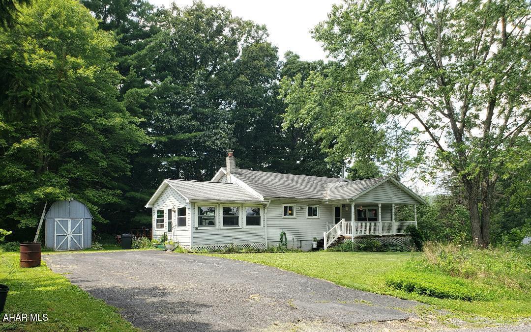 1-story 3-bedroom 1-bath vinyl sided home with sunroom, nice front porch & back deck on .54 acres. J-625