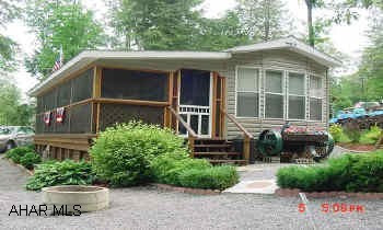 Park Model w/ full length porch covered & screened, Immiculate inside and out.  Shed included  2001 Park Model Immaculate on deeded lot.  Full length porch covered & screened. Shed included1 Bedroom, 1 bath, 2 sofa beds in livingroom.  Sleeps 6
