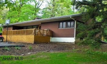Sinken Valley ranch on 1.3 acres w/ LR., DR., 2BR., 1 new bath, hardwood floors, 2 fireplaces, kitchen w/ appliances Privacy and Comfort in this Sinking Valley ranch home on 1.3 acres w/ stream, LR., DR., w/ hardwood floors, & fireplace, kitchen w/ stainless appliances, new bath, 2 BR., wood/oil/ coal combo furnace, sunporch, deck, & pavilion to enjoy the view!