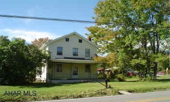 2 & 1/2 story frame house, 2 garages, shed. House needs extensive remodeling! No furnace, no electrical service panel, no radiators.